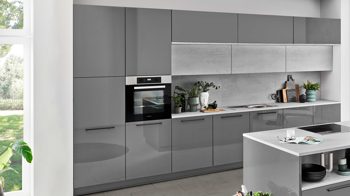 Einbauküche Nolte® küchen aus Holz in Grau nolte® Einbauküche Lux mit Miele Einbaugeräten Quarzgrau & weißer Beton – zweizeilig