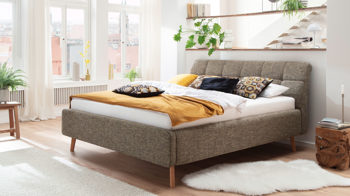 Polsterbett Meise.möbel aus Stoff in Braun Polsterbettgestell Mila mit Bettkasten, gestepptes Kopfteil brauner Struktur Bezug Building 801 & Holzfüße - Liegefläche ca. 180 x 200 cm